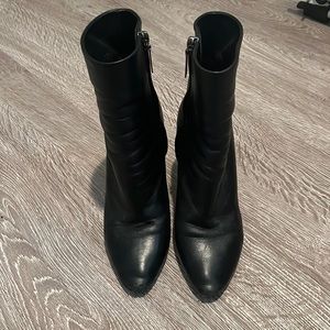 Saint Laurent Lou black heel boots.